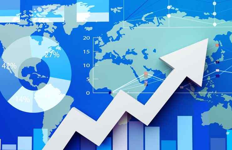 freccia verso l'alto e mappa del mondo